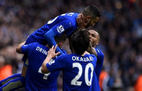 Riyad Mahrez of Leicester City celebrates with his teammates.