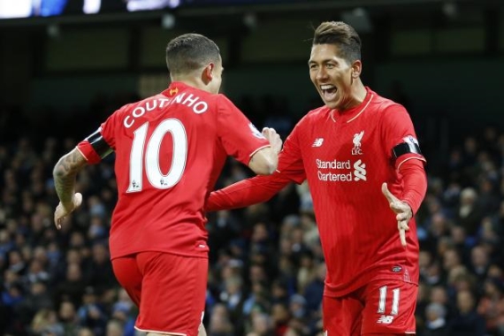 Liverpool's Brazilian duo Philippe Coutinho and Roberto Firmino celebrating