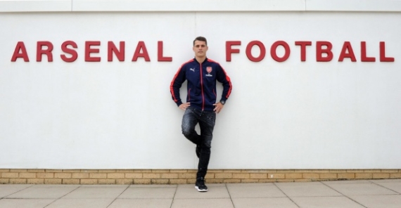 Granit Xhaka posing by Arsenal's training ground