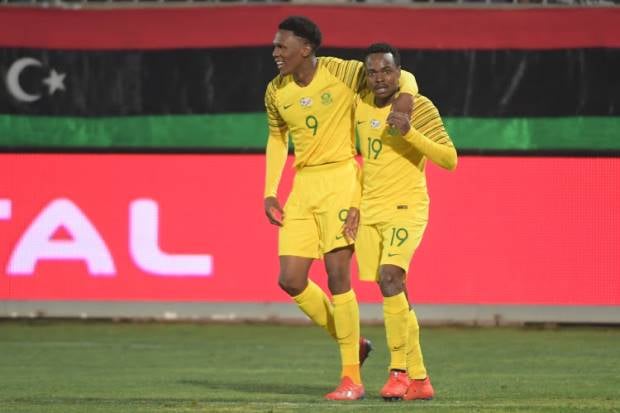 Bafana Bafana players Lebo Mothiba and Percy Tau hugging after a goal