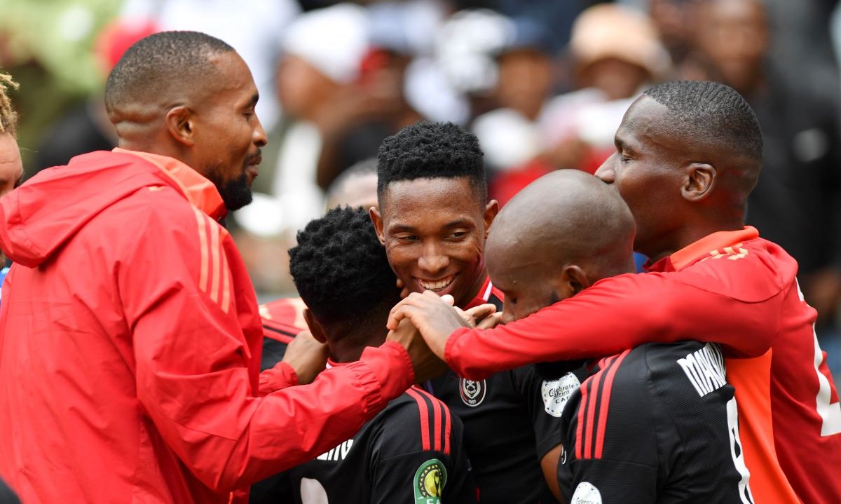 Thalente Mbatha of Orlando Pirates celebrates with teammates in CAF Champions League.