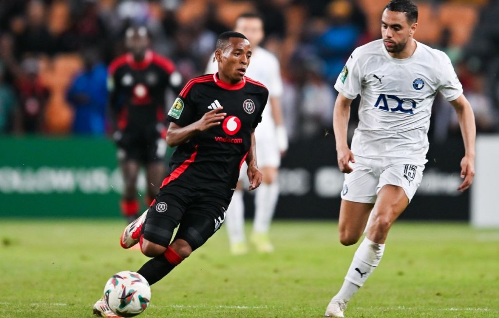 Relebohile Mofokeng of Orlando Pirates challenged by Mohamed Chibi of Pyramids during the CAF Champions League 2024/25 Semi Final 1st Leg match between Orlando Pirates and Pyramids FC at FNB Stadium in Johannesburg, South Africa on 19 April 2025 ©/BackpagePix