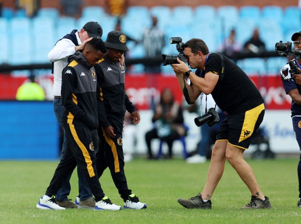 Mduduzi Shabalala and Mfundo Vilakazi of Kaizer Chiefs do pitch inspection with coach Nasreddine Nabi