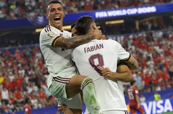 Mikel Merino (R) of Spain celebrates with Fabian Ruiz (C) and Pedro Porro (up) after scoring the 1-0 lead during the FIFA World Cup 2026 Round of 16 match Portugal against Spain, in Dallas, USA, 06 July 2026. EPA/CHRISTOPHER NEUNDORF
