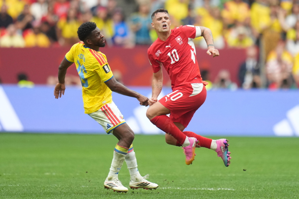 Andres Gomez of Colombia (L) in action against Granit Xhaka of Switzerland (R) during the FIFA World Cup 2026 Round of 16 match Switzerland against Colombia, in Vancouver, Canada, 07 July 2026. EPA/BOB FRID