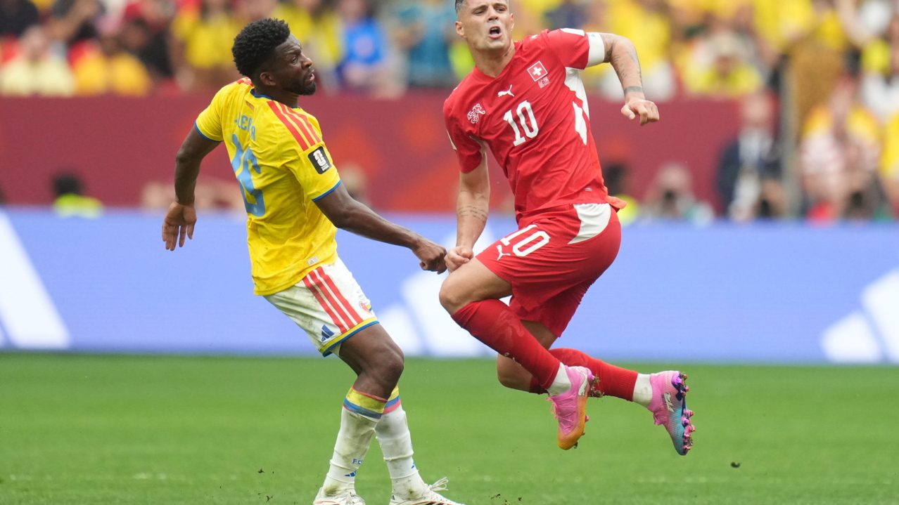 Andres Gomez of Colombia (L) in action against Granit Xhaka of Switzerland (R) during the FIFA World Cup 2026 Round of 16 match Switzerland against Colombia, in Vancouver, Canada, 07 July 2026. EPA/BOB FRID