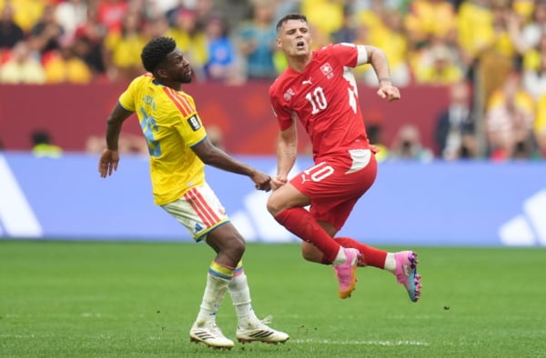 Andres Gomez of Colombia (L) in action against Granit Xhaka of Switzerland (R) during the FIFA World Cup 2026 Round of 16 match Switzerland against Colombia, in Vancouver, Canada, 07 July 2026. EPA/BOB FRID