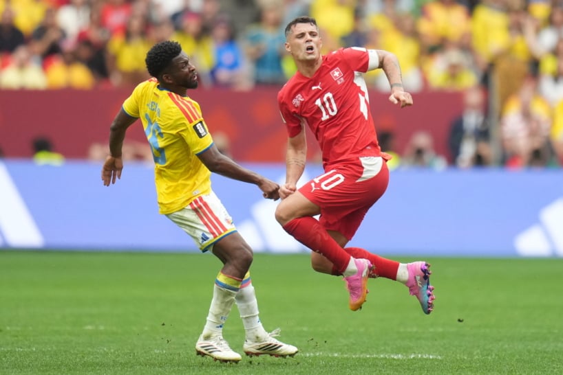 Andres Gomez of Colombia (L) in action against Granit Xhaka of Switzerland (R) during the FIFA World Cup 2026 Round of 16 match Switzerland against Colombia, in Vancouver, Canada, 07 July 2026. EPA/BOB FRID