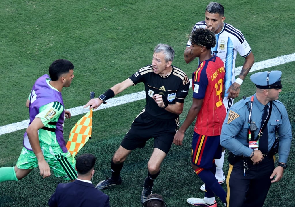 Assistant referee Tomaz Klancnik (C) gets between Lamine Yamal (R) of Spain and a substitute from the Argentinian bench during the FIFA World Cup 2026 final match Spain against Argentina, in New Jersey, USA, 19 July 2026. EPA/RONALD WITTEK