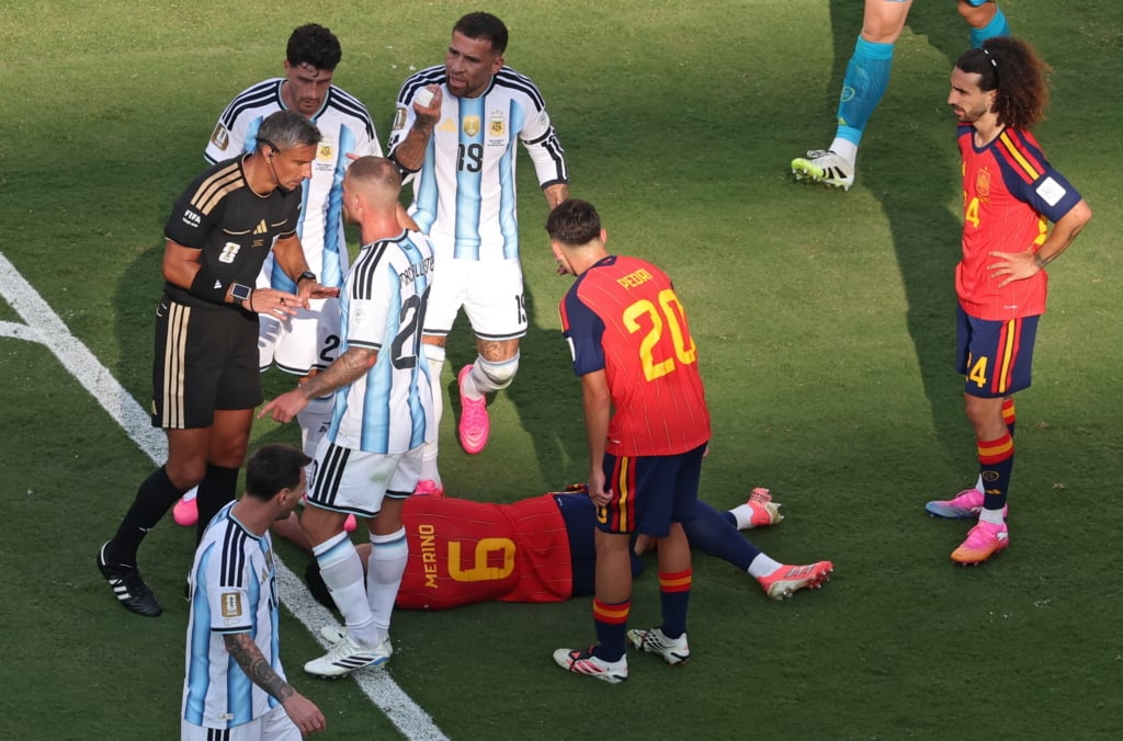 Referee Slavko Vincic (L) checks on Mikel Merino of Spain (bottom C) lying on the ground during the FIFA World Cup 2026 final match Spain against Argentina, in New Jersey, USA, 19 July 2026. EPA/SARAH YENESEL