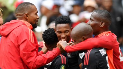 Thalente Mbatha of Orlando Pirates celebrates with teammates in CAF Champions League.