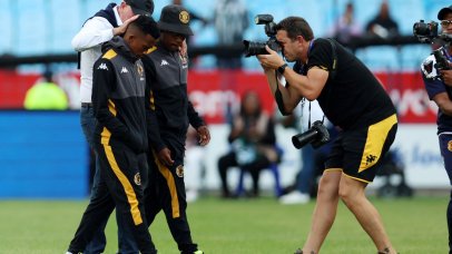Mduduzi Shabalala and Mfundo Vilakazi of Kaizer Chiefs do pitch inspection with coach Nasreddine Nabi