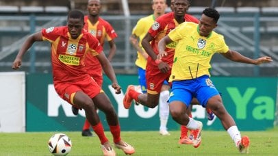 Lufuno Malaudzi of Mpheni Home Defenders and Kobamelo Kodisang of Mamelodi Sundowns compete against each other in the Nedbank Cup.