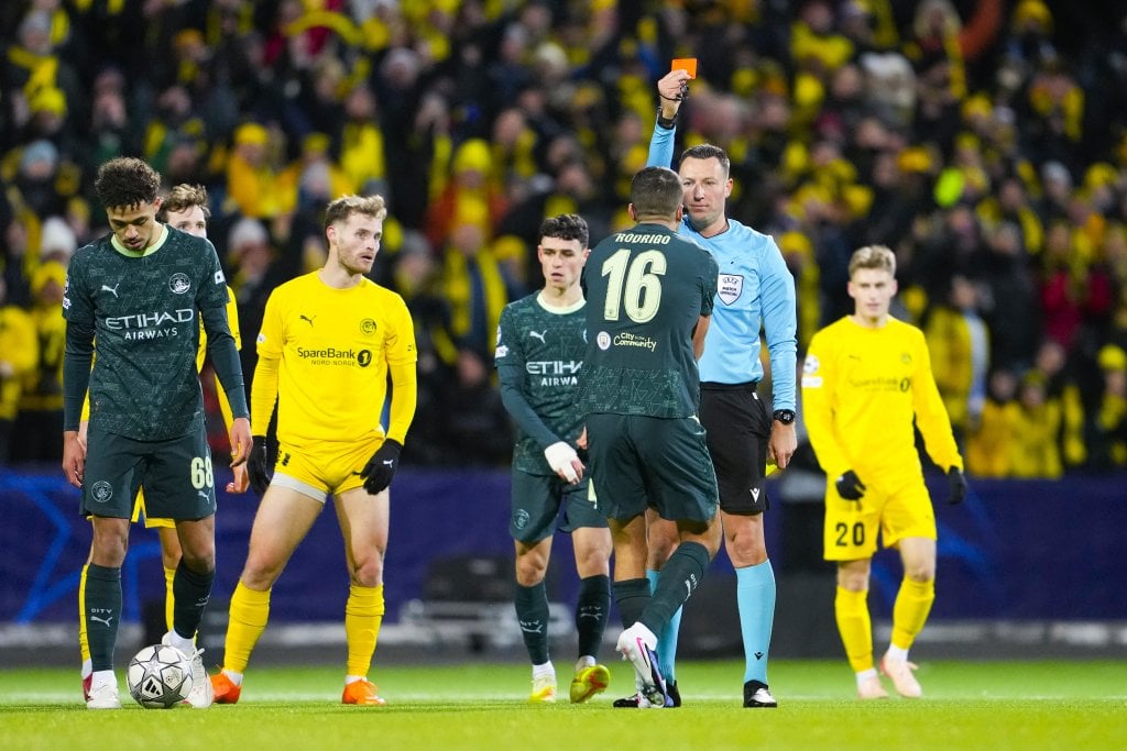 Referee Sven Jablonski shows a red card to Manchester City's Rodrigo Hernandez Cascante during the UEFA Champions League soccer match between Bodo/Glimt and Manchester City at Aspmyra Stadium in Bodo, Norway, 20 January 2026. EPA/Fredrik Varfjell NORWAY OUT