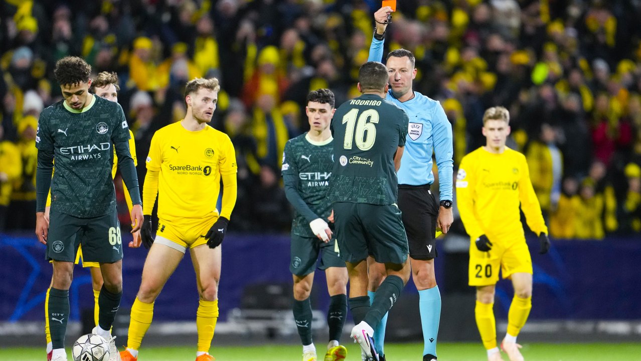 Referee Sven Jablonski shows a red card to Manchester City's Rodrigo Hernandez Cascante during the UEFA Champions League soccer match between Bodo/Glimt and Manchester City at Aspmyra Stadium in Bodo, Norway, 20 January 2026. EPA/Fredrik Varfjell NORWAY OUT