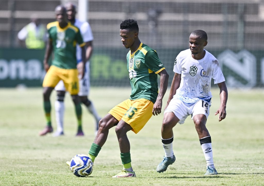 Themba Mantshiyane of Golden Arrows is challenged by Alucious Wagaba of Orbit College FC during the 2026 Nedbank Cup restarted match between Golden Arrows and Orbit College at King Zwelithini Stadium, Durban on 8 February 2026 ©Gerhard Duraan/BackpagePix