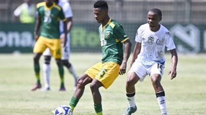 Themba Mantshiyane of Golden Arrows is challenged by Alucious Wagaba of Orbit College FC during the 2026 Nedbank Cup restarted match between Golden Arrows and Orbit College at King Zwelithini Stadium, Durban on 8 February 2026 ©Gerhard Duraan/BackpagePix