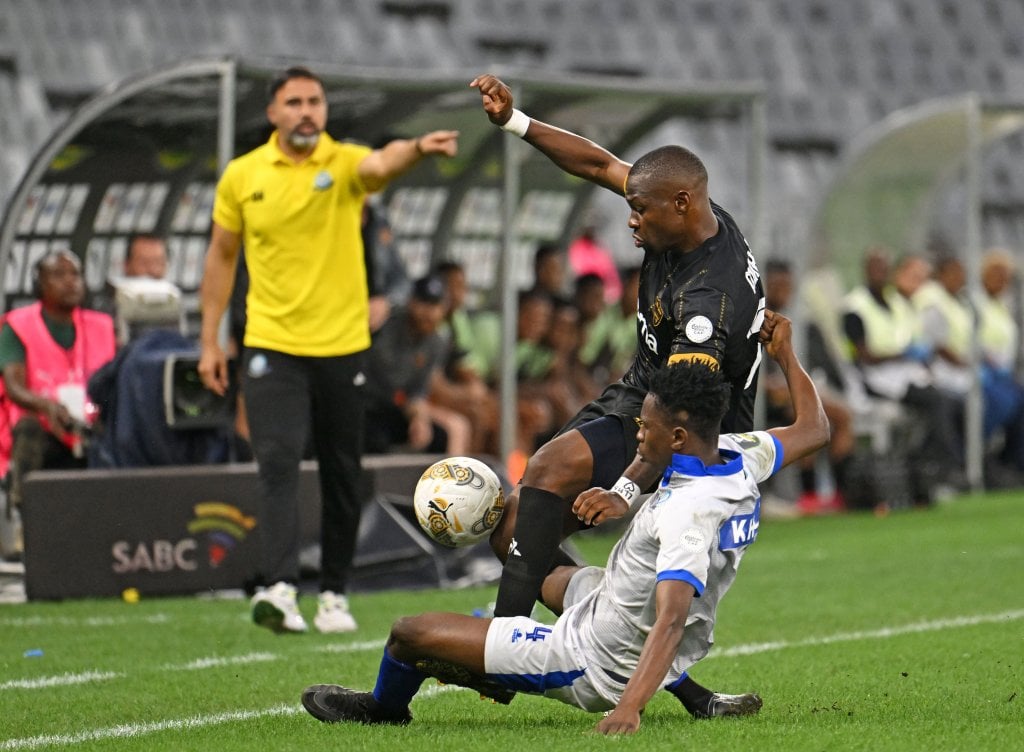 Tshegofatso Mabasa of Stellenbosch FC is fouled by Khalid Iddi of Singida Black Stars during the CAF Confederation Cup 2025/26 game between Stellenbosch FC and Singida Black Stars at Cape Town Stadium in Cape Town on 15 February 2026 © Ryan Wilkisky/BackpagePix