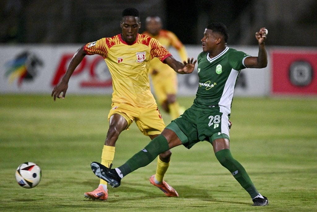Lopes Gustavo of AmaZulu FC is challenged by Sifiso Luthuli of Magesi FC during the Betway Premiership 2025/26 match between AmaZulu and Magesi at Princess Magogo Stadium, Durban on 4 March 2026 ©Gerhard Duraan/BackpagePix