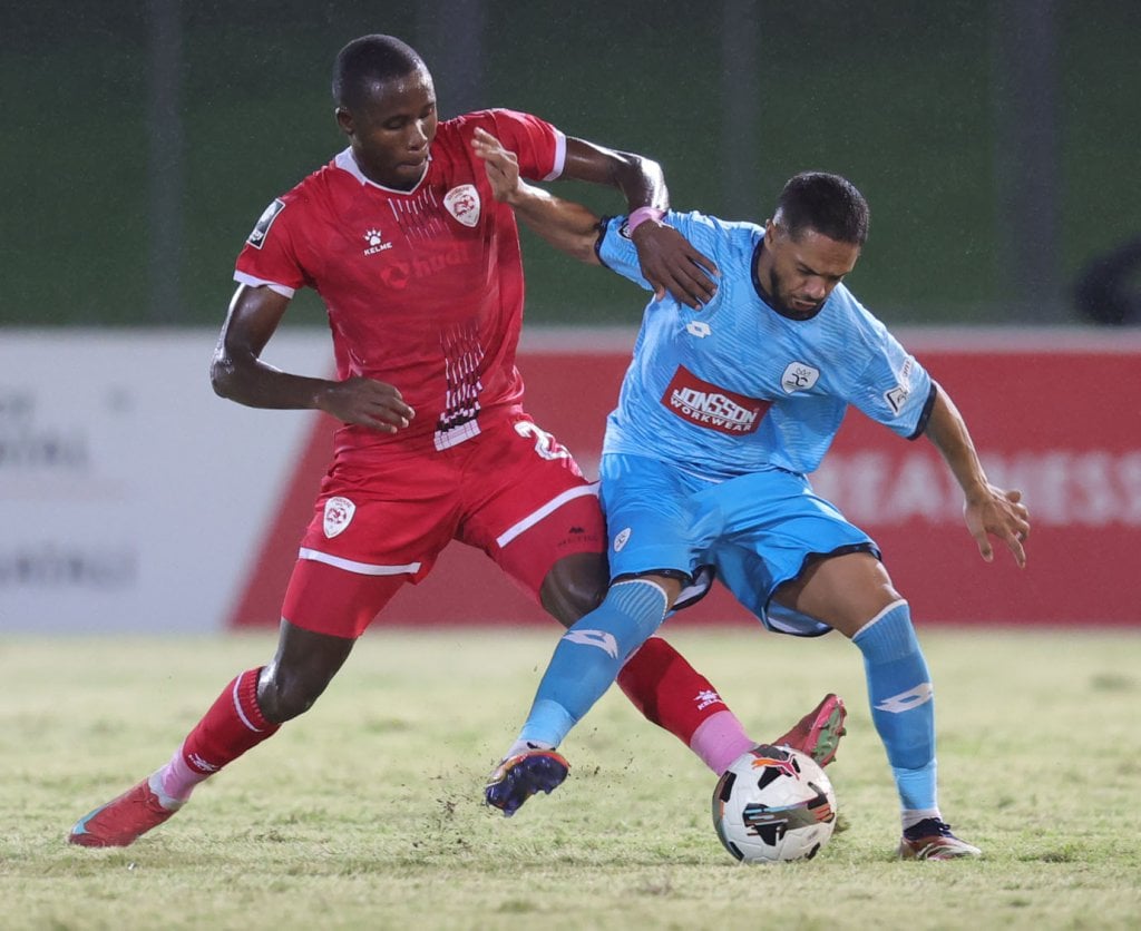 Haashim Domingo of Durban City challenged by Vuyo Letlapa of Sekhukhune United during the Betway Premiership 2025/26 match between Durban City and Sekhukhune United at Chatsworth Stadium in Durban on 04 March 2026 ©Samuel ShivambuBackpagePix
