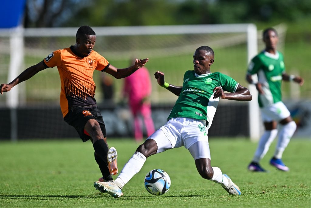 Bonginkosi Dlamini of Polokwane City fouled by Nkosikhona Radebe of AmaZulu during the Betway Premiership 2025/26 match between Polokwane City and Amazulu at Old Peter Mokaba Stadium in Polokwane on 21 March 2026 ©Alche Greeff/BackpagePix